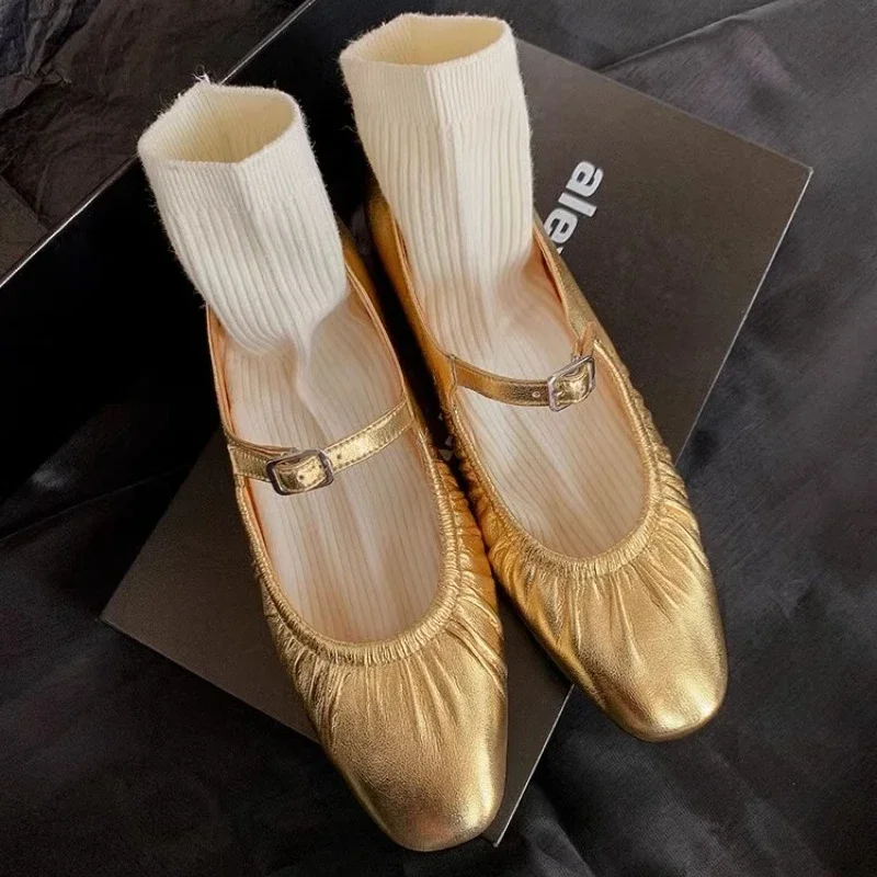 gold flat shoes